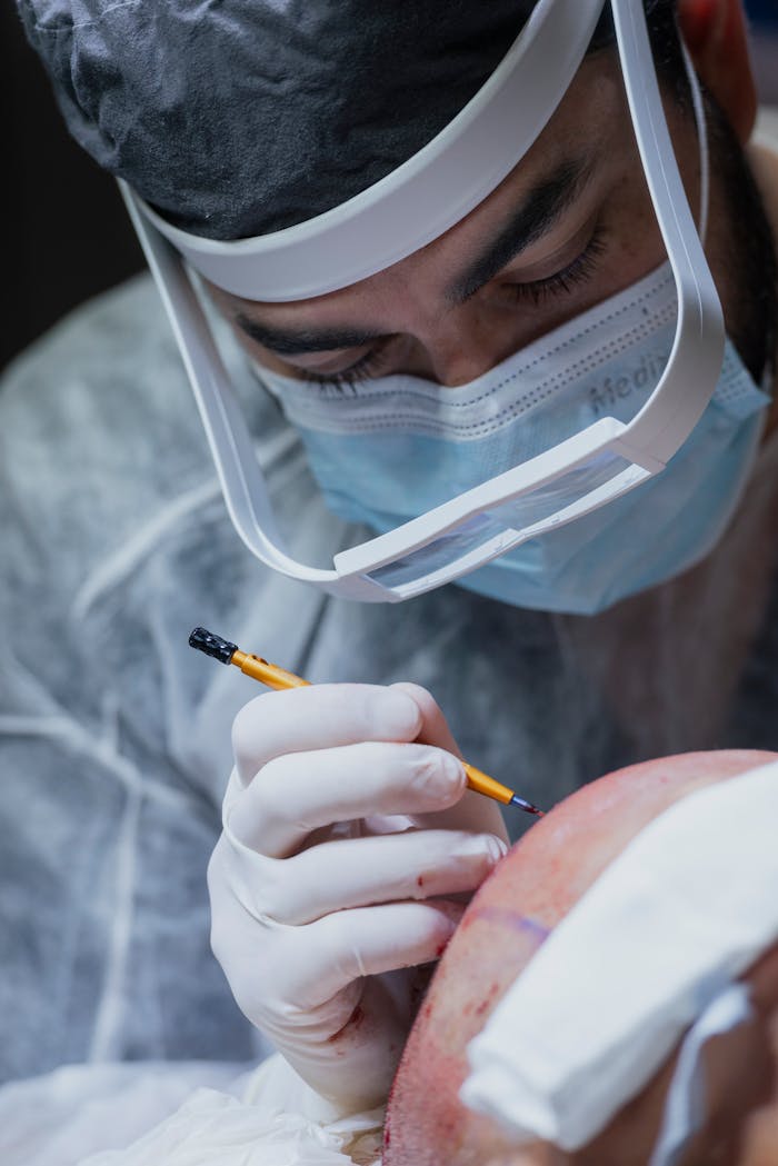 Close-up of a neurosurgeon carefully operating on a patient in a hospital setting.